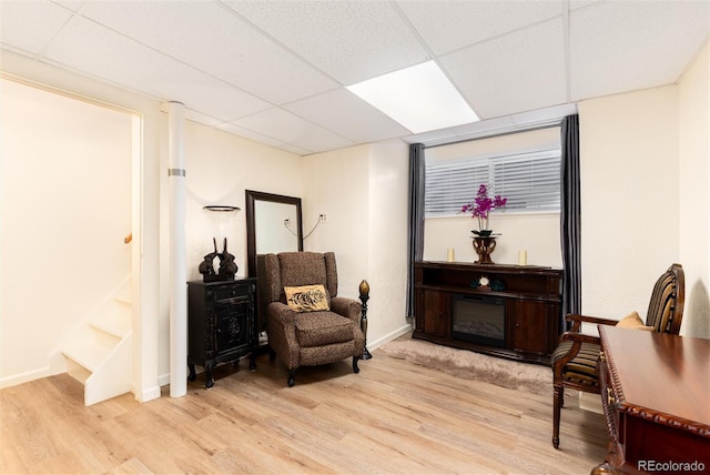 5215 S Washington St, Littleton, CO 80121 - living area featuring light wood finished floors and a drop ceiling