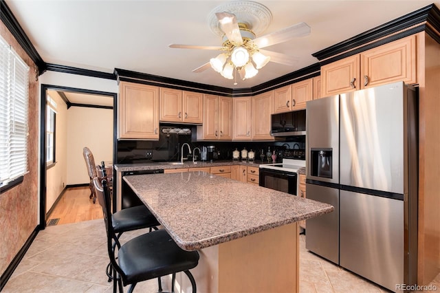 5215 S Washington St, Littleton, CO 80121 - kitchen with stainless steel fridge, black range with electric stovetop, dishwashing machine, ceiling fan, and decorative backsplash
