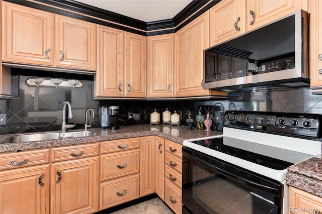 5215 S Washington St, Littleton, CO 80121 - kitchen featuring stainless steel microwave, black range with electric cooktop, backsplash, tile counters, and light brown cabinetry