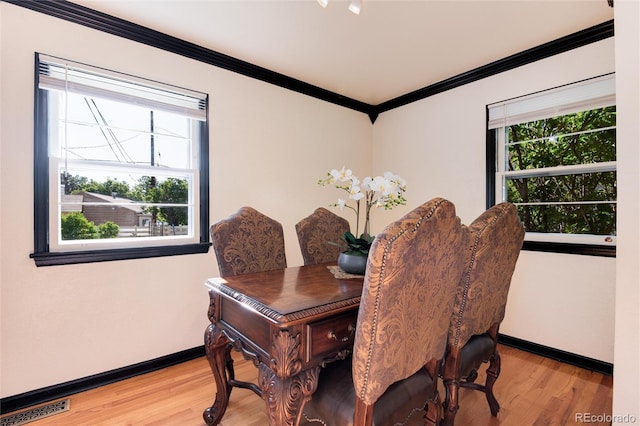 5215 S Washington St, Littleton, CO 80121 - dining space featuring crown molding and light wood-style floors