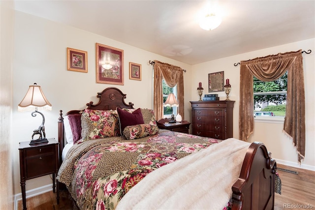 5215 S Washington St, Littleton, CO 80121 - bedroom with wood finished floors and multiple windows