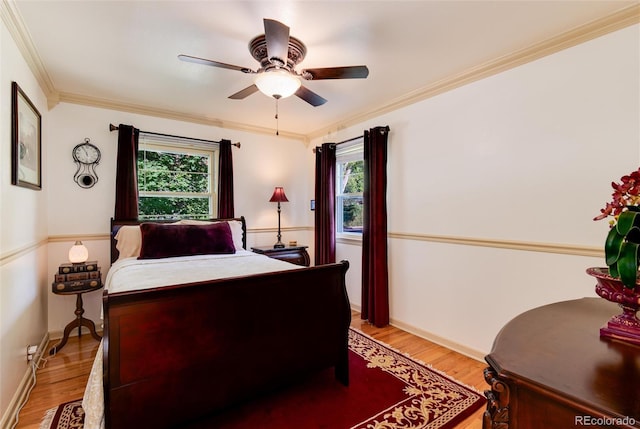 5215 S Washington St, Littleton, CO 80121 - bedroom featuring light wood-style floors, multiple windows, crown molding, and ceiling fan