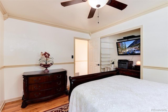 5215 S Washington St, Littleton, CO 80121 - bedroom featuring wood finished floors, crown molding, and a ceiling fan