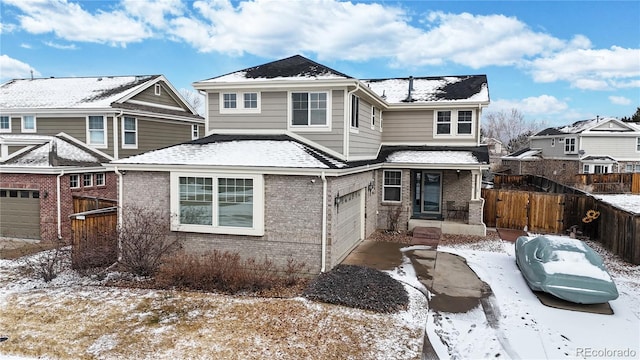 view of property with a garage and a porch