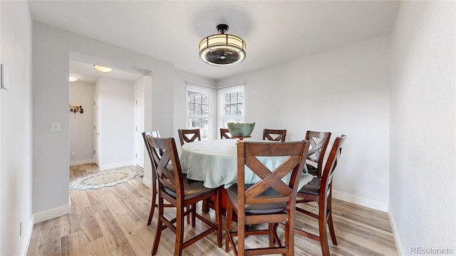 dining space featuring light hardwood / wood-style floors