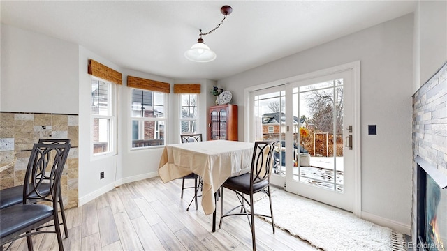 dining room featuring plenty of natural light and light hardwood / wood-style floors