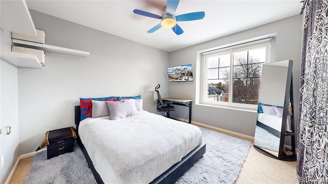 bedroom featuring ceiling fan and carpet flooring