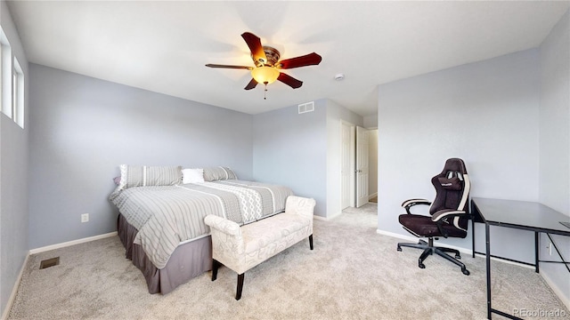 bedroom featuring light colored carpet and ceiling fan