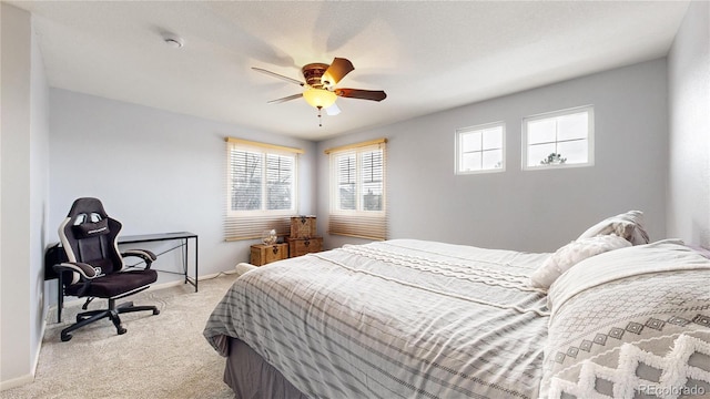 bedroom with light carpet and ceiling fan