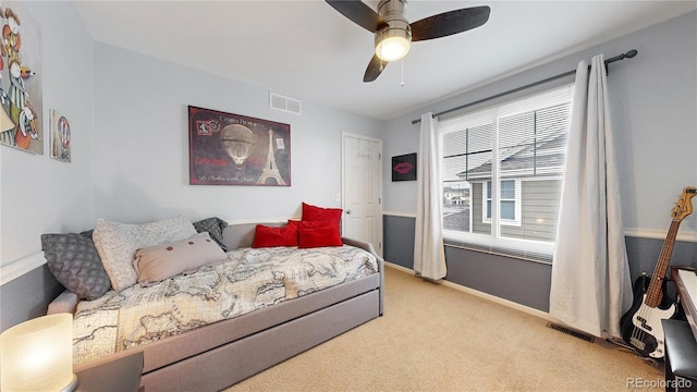 carpeted bedroom featuring ceiling fan