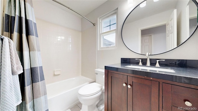 full bathroom with vanity, shower / bath combination with curtain, and toilet