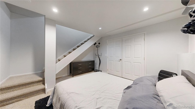 bedroom with carpet and a closet