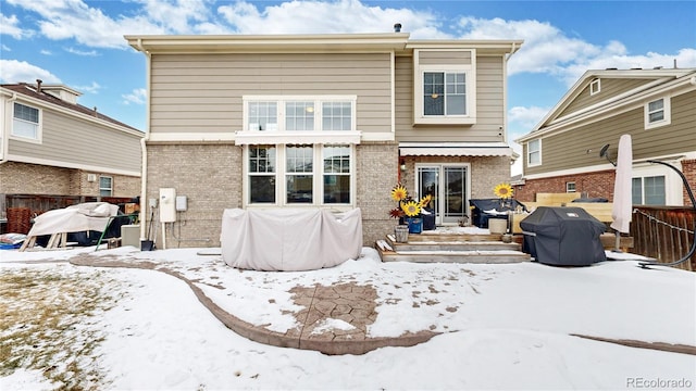 view of snow covered house