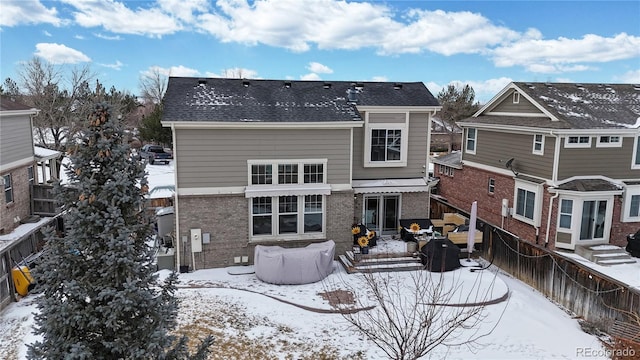 view of snow covered house