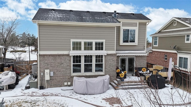 view of snow covered house