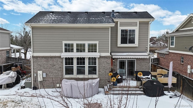 view of snow covered house