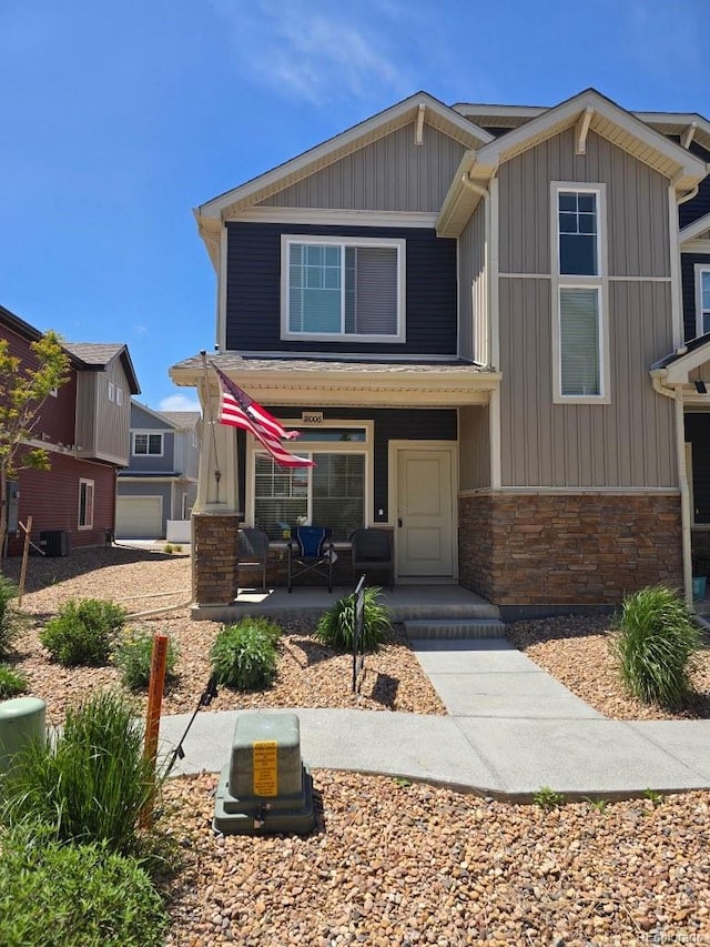 18006 E 103rd Ave, Commerce City, CO 80022 - view of front facade with a porch, stone siding, and central air condition unit