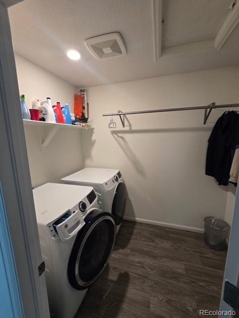 18006 E 103rd Ave, Commerce City, CO 80022 - washroom with washing machine and dryer, wood finished floors, attic access, and baseboards