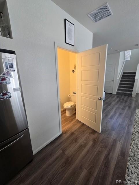 18006 E 103rd Ave, Commerce City, CO 80022 - corridor with dark wood finished floors and stairway