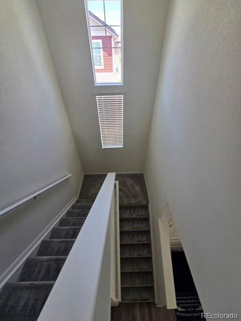 18006 E 103rd Ave, Commerce City, CO 80022 - stairway featuring wood finished floors