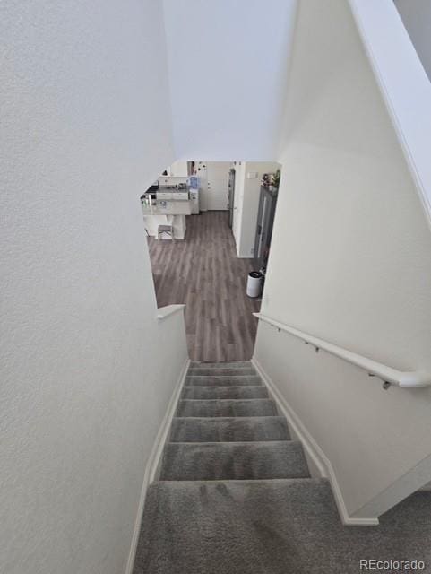 18006 E 103rd Ave, Commerce City, CO 80022 - stairs featuring wood finished floors