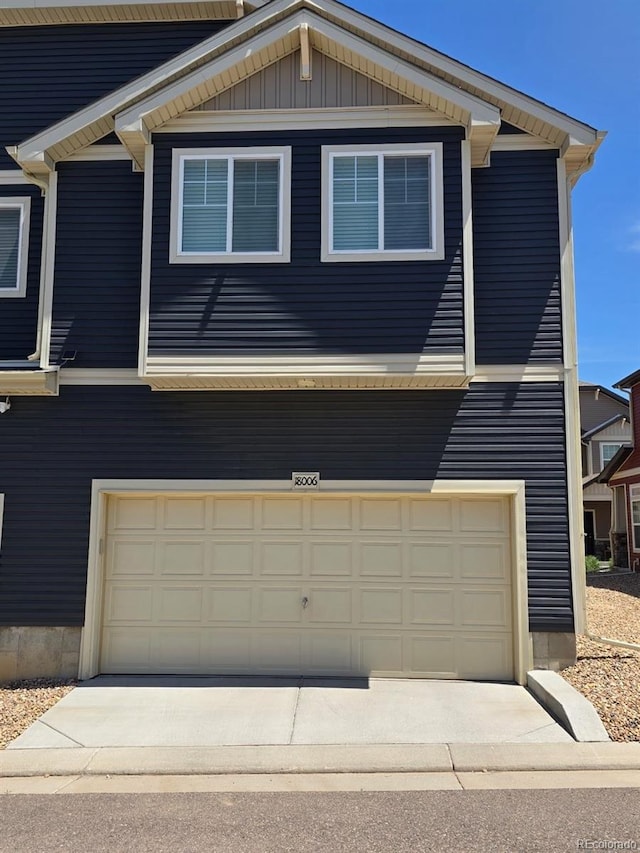 18006 E 103rd Ave, Commerce City, CO 80022 - view of front facade with an attached garage and driveway