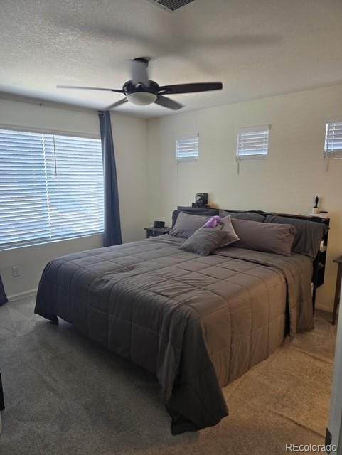 18006 E 103rd Ave, Commerce City, CO 80022 - carpeted bedroom featuring baseboards and ceiling fan