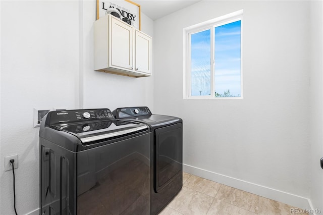 5470 Krameria St, Commerce City, CO 80022 - laundry room featuring washing machine and dryer, cabinet space, baseboards, and light tile patterned floors