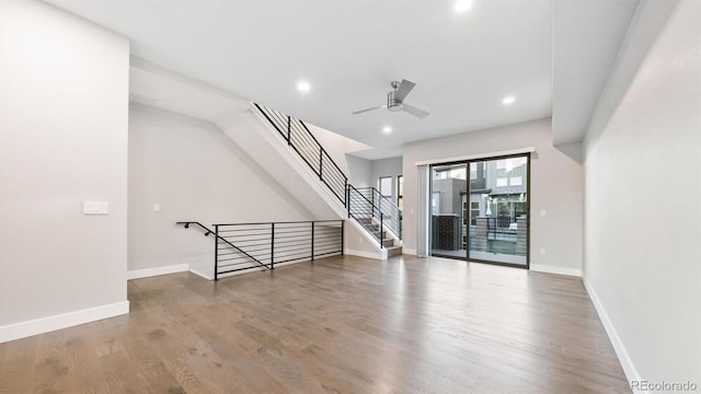 unfurnished living room with ceiling fan and hardwood / wood-style floors