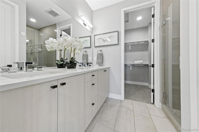 bathroom with an enclosed shower and vanity