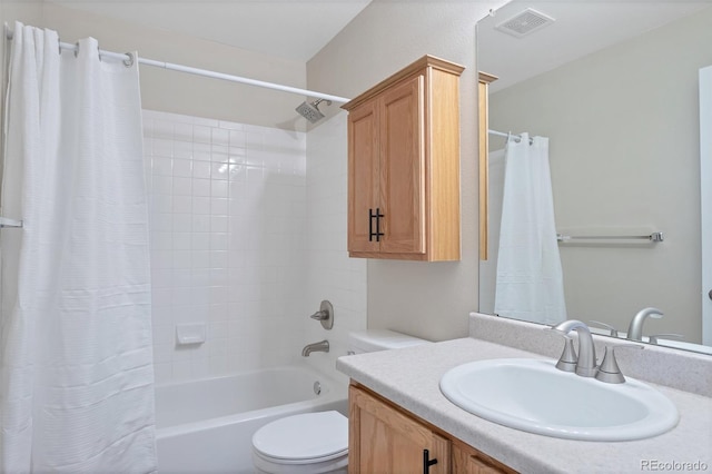 full bathroom with vanity, toilet, and shower / tub combo with curtain