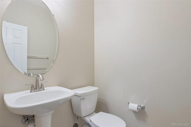 bathroom with toilet and sink