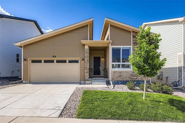 268 Simmental Loop, Castle Rock, CO 80104 - mid-century home featuring an attached garage, driveway, brick siding, and a front lawn
