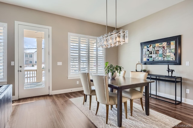 268 Simmental Loop, Castle Rock, CO 80104 - dining area featuring wood finished floors and a chandelier