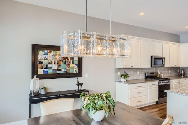268 Simmental Loop, Castle Rock, CO 80104 - dining space with dark wood-style flooring and recessed lighting