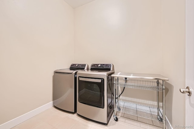268 Simmental Loop, Castle Rock, CO 80104 - laundry room with washing machine and dryer and light tile patterned flooring