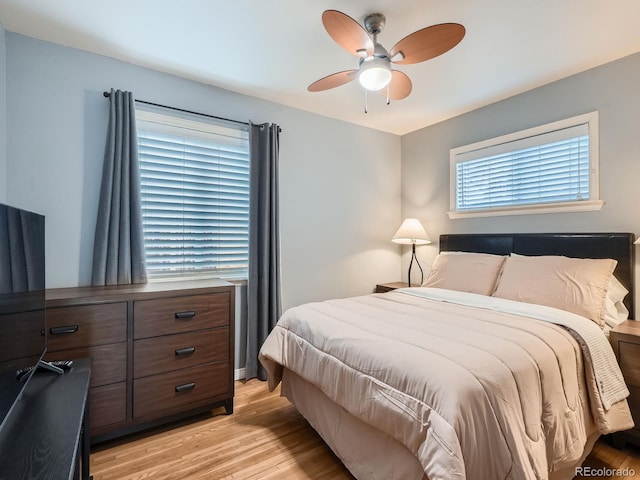 bedroom featuring ceiling fan and light hardwood / wood-style flooring