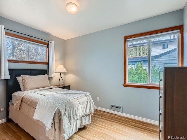 bedroom featuring light wood-type flooring