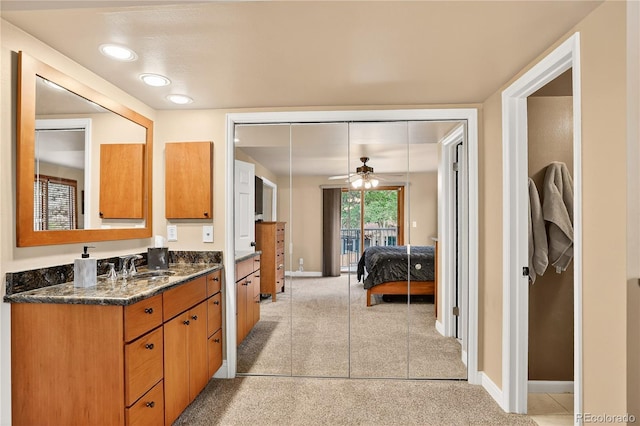 6338 S Oneida Ct, Centennial, CO 80111 - ensuite bathroom with vanity and a ceiling fan