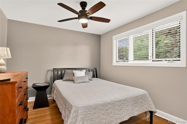 6338 S Oneida Ct, Centennial, CO 80111 - bedroom with wood finished floors and a ceiling fan