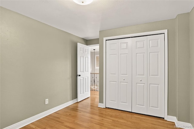 6338 S Oneida Ct, Centennial, CO 80111 - unfurnished bedroom featuring light wood finished floors and a closet