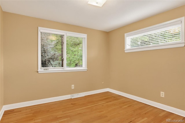 6338 S Oneida Ct, Centennial, CO 80111 - spare room with light wood-style flooring and baseboards