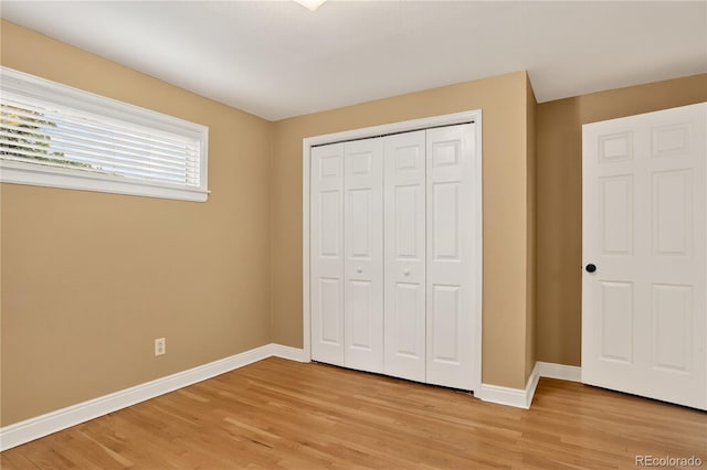 6338 S Oneida Ct, Centennial, CO 80111 - unfurnished bedroom featuring light wood-style floors and a closet