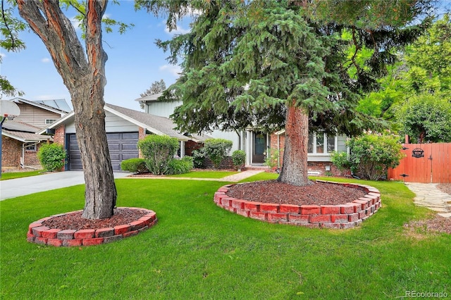 6338 S Oneida Ct, Centennial, CO 80111 - obstructed view of property with concrete driveway, brick siding, an attached garage, and a gate