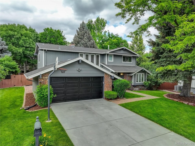 6338 S Oneida Ct, Centennial, CO 80111 - view of front of home with a garage, driveway, roof with shingles, brick siding, and a chimney