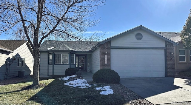 single story home with a garage and central air condition unit