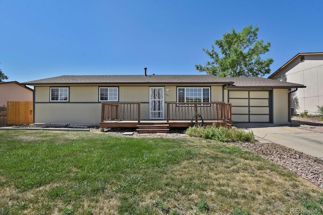 8381 Vine St, Denver, CO 80229 - single story home with concrete driveway, an attached garage, and a wooden deck