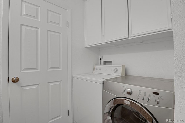 8381 Vine St, Denver, CO 80229 - washroom with washing machine and clothes dryer and cabinet space