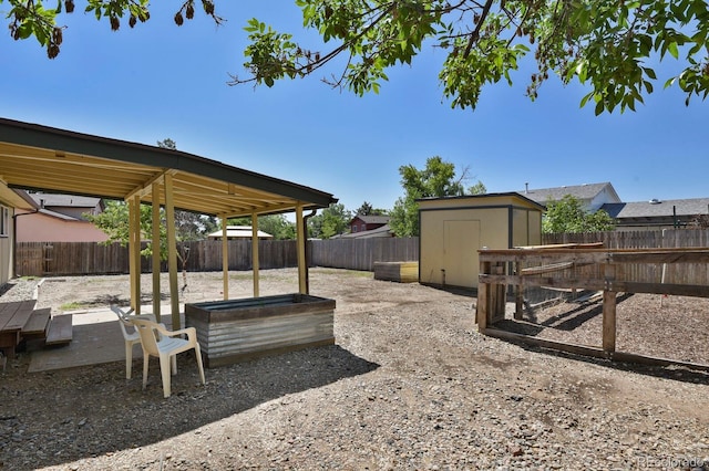 8381 Vine St, Denver, CO 80229 - fenced backyard with a storage shed and a patio area