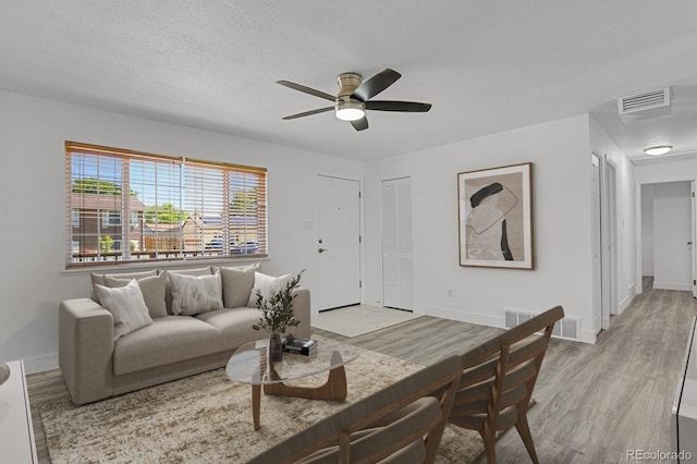8381 Vine St, Denver, CO 80229 - living area with ceiling fan and light wood finished floors